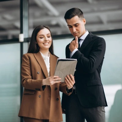 Two people looking at a document